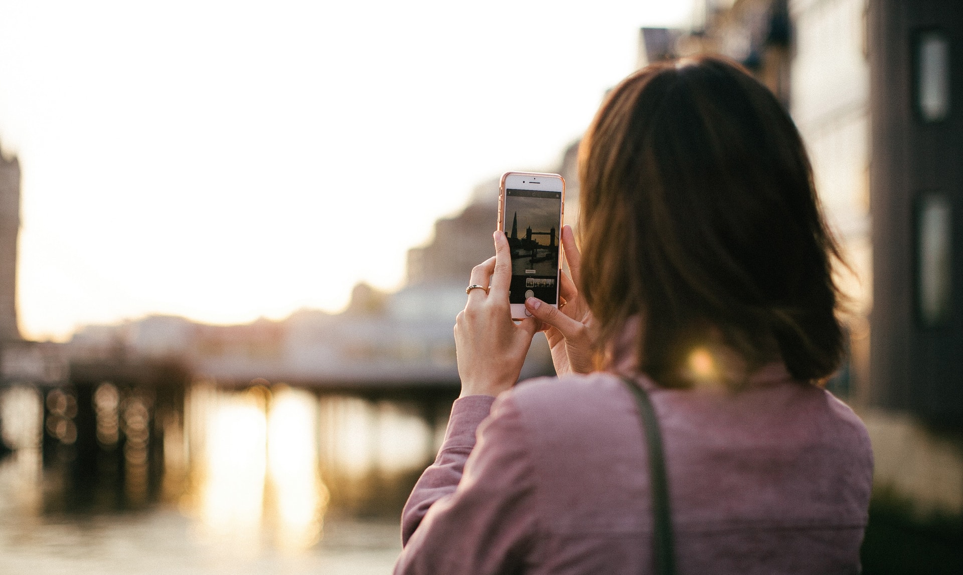Tourist taking a photo of a landmark on their phone