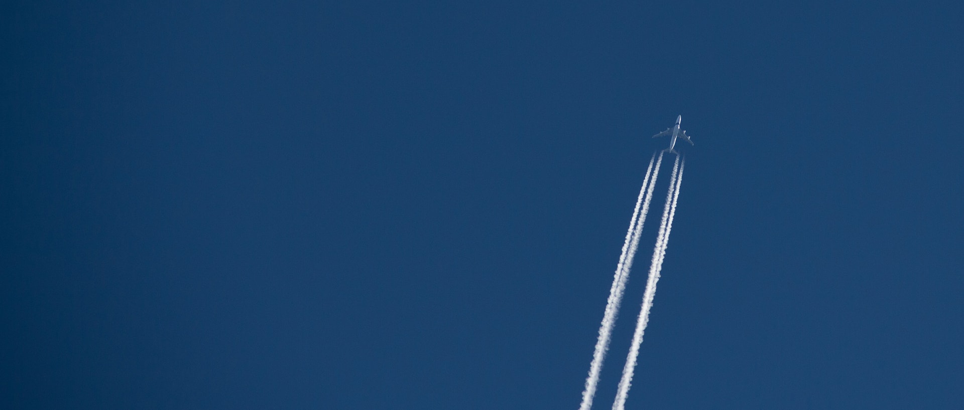 Airplane rising against a blue sky