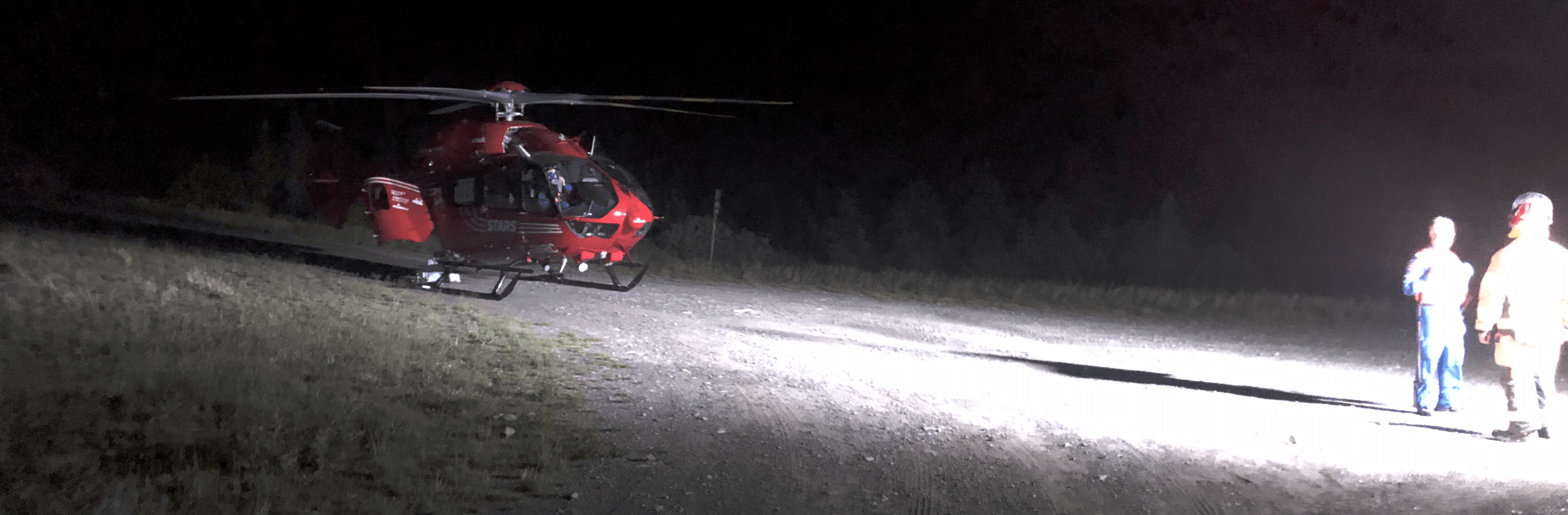 A STARS helicopter rescue at night on a mountain road